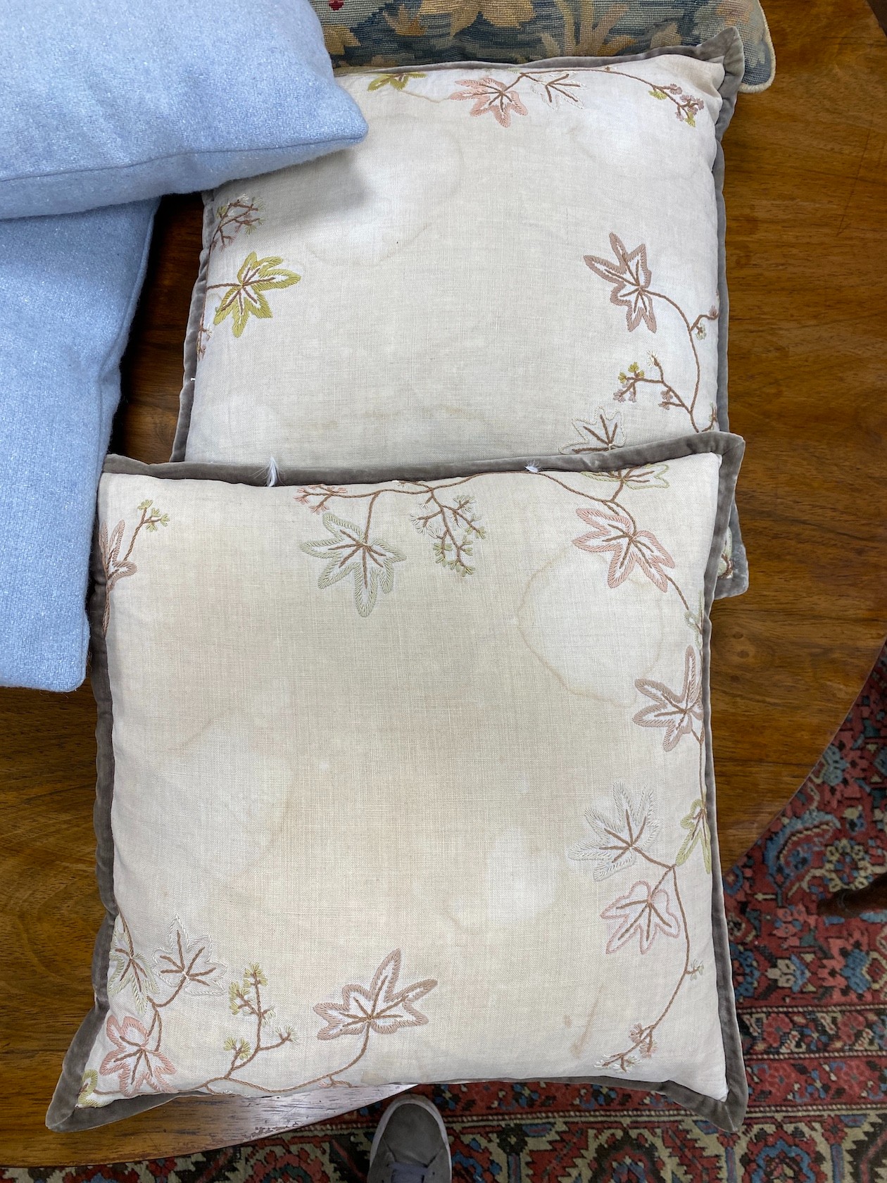 A 19th century petit point polychrome tapestry now as a cushion, 48cm x 46cm together with four later cushions.